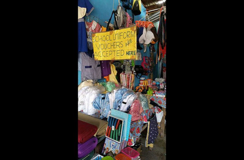 One of the stalls in the Mackenzie Arcade with the school uniform voucher sign