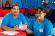 Dr Lachmie Lall providing a child with the eye testing voucher