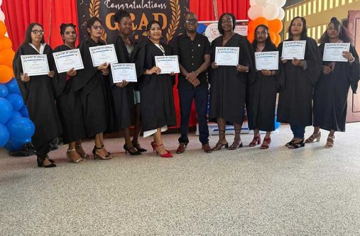 BIT CEO Richard Maughn with graduates on Sunday (BIT photo)