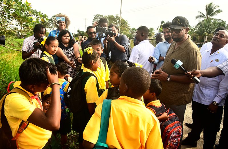 President, Dr Irfaan Ali interacting with youths of Yarrowkabra (Adrian Narine photo)