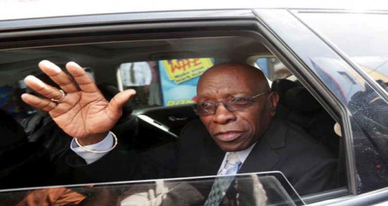 Former FIFA vice-president Jack Warner waves after leaving the court earlier this month.