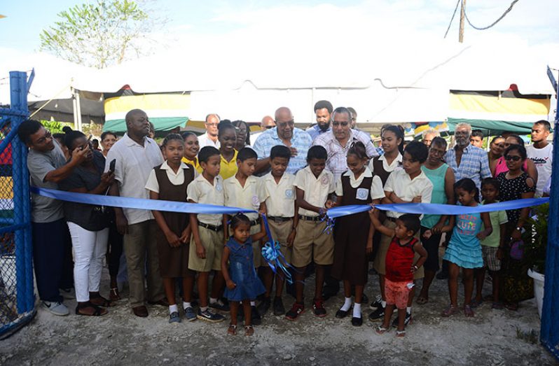 Students of the Blake Primary School did the symbolic ribbon cutting that marked the Hubu Well as opened
