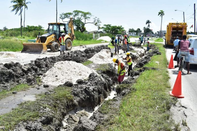 One works to lay new pipelines along Cemetery Road||A flooded area of the Le Repentir Cemetery where the pipeline ruptured