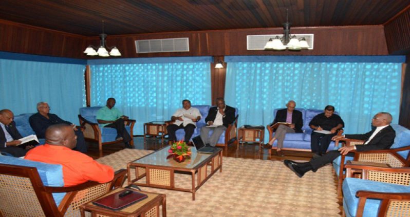 water President David Granger in discussions with (at his right) Ministers Sydney Allicock, Ronald Bulkan and Joseph Harmon. Ministers Raphael Trotman and Noel Holder are sitting second and third from left respectively, while Director General of Guyana's Civil Defence Commission; Retired Colonel Chabilall Ramsarup is at fourth from right