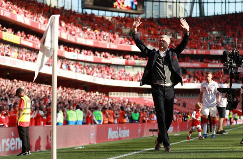 Arsenal manager Arsene Wenger waves to the fans after the match REUTERS/Ian Walton