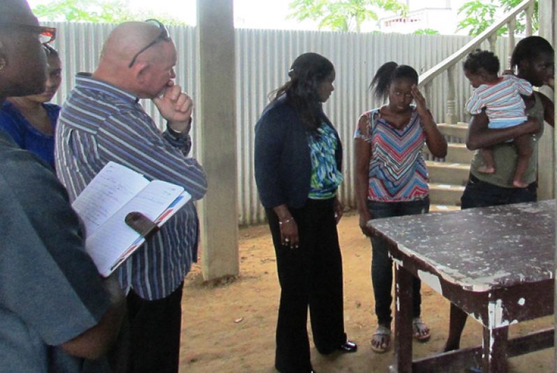 Minister of Human Services and Social Security, Ms. Jennifer Webster, speaking to the Bagot sisters’ sibling Malkia Bagot. Also in picture are Deputy Permanent Secretary of the Ministry, Mr. Patrick Findlay; Probation Officer in Region 6, Mrs. Claudia Munroe and the girls’ cousin Ms. Renata Joseph.