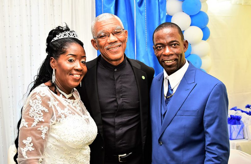 President David Granger with the newly-weds: Minister within the Ministry of Communities with responsibility for Housing, Mrs. Valerie Patterson-Yearwood and Mr. Godfrey Yearwood