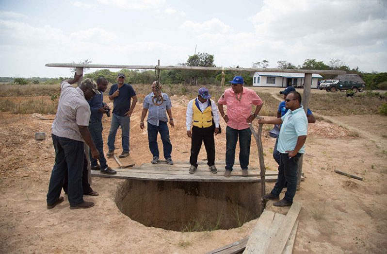 GWI Managing-Director, Dr. Richard Van-West Charles and GWI and regional officials examine one of the deficient wells