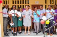 Minister of Education Priya Manickchand (centre) flanked by students and faculty members of the West Demerara Secondary