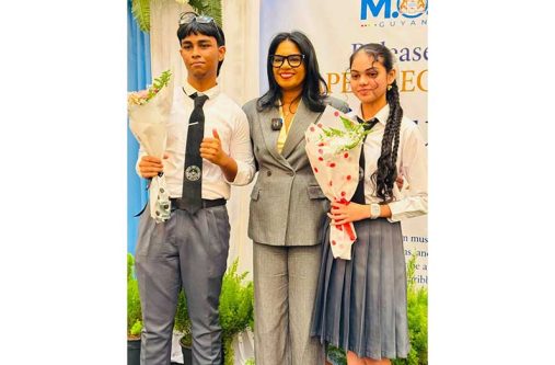 Dishon Nundalall and Ayesha Brijlall with Minister of Education, Sonia Parag, during the CSEC preliminary results announcement ceremony held in Georgetown in August (West Side High photo)