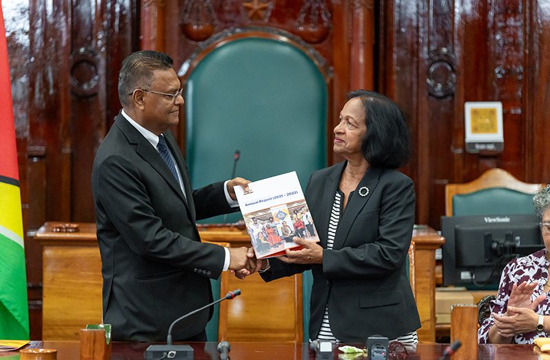 Speaker of the National Assembly, Manzoor Nadir (left), receiving the 2021-2022 annual report from the Chairperson of the Women and Gender Equality Commission, Indranie Chandarpal (Delano Williams photo)