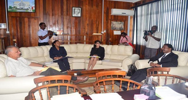 Attorney General and Minister of Legal Affairs Basil Williams in meeting with members of the Financial Intelligence Unit