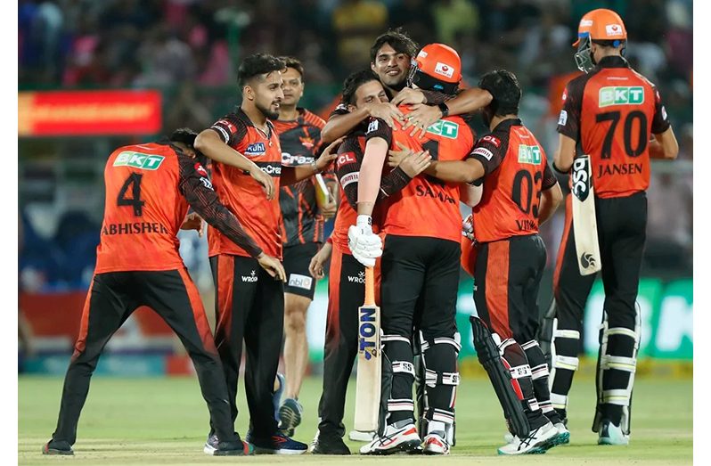 Abdul Samad is embraced by players after he won the match with a last-ball six•May 07, 2023•BCCI