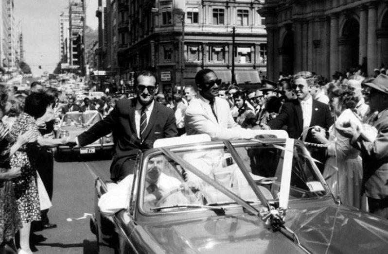 February 20, 1961 West Indies team manager Gerry Gomez and captain Frank Worrell are cheered by a huge crowd in a parade through the streets of Melbourne.