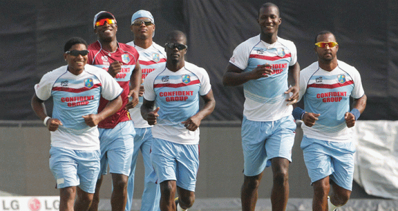 From left, West Indies’ Krishmar Santokie, Andre Russell, Marlon Samuels, Andre Fletcher, skipper Darren Sammy and Dwayne Smith, complete a light jog during one of their training sessions, prior to today’s game against Australia. (Photo courtesy flickr.com/windiescricket)