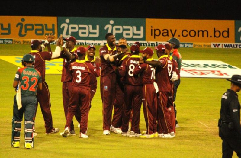 The West Indies players celebrate their victory, to level the series 1-1.