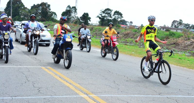 Colombian Carlos Ospina of Team Coco’s crosses the finish line unchallenged yesterday to win the fifth and final stage of the Tour of Guyana’ Five-Stage Cycle road race, but was later disqualified