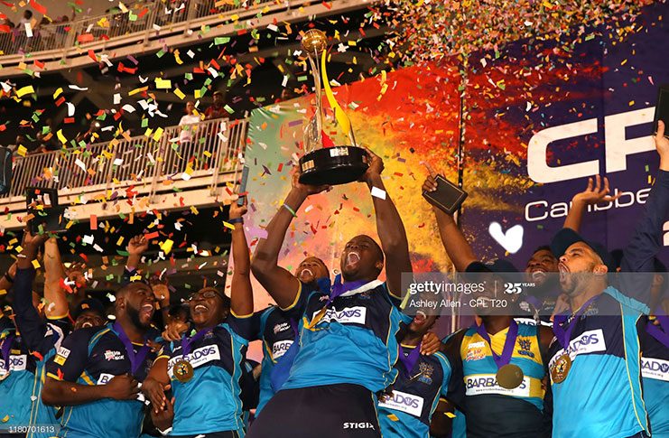 In this handout image provided by CPL T20, Jason Holder captain of Barbados Tridents lifts the Hero CPL trophy during the Hero Caribbean Premier League Final between Guyana Amazon Warriors and Barbados Tridents at Brian Lara Stadium on October 12, 2019 in Tarouba, Trinidad And Tobago. (Photo by Ashley Allen - CPL T20/CPL T20 via Get