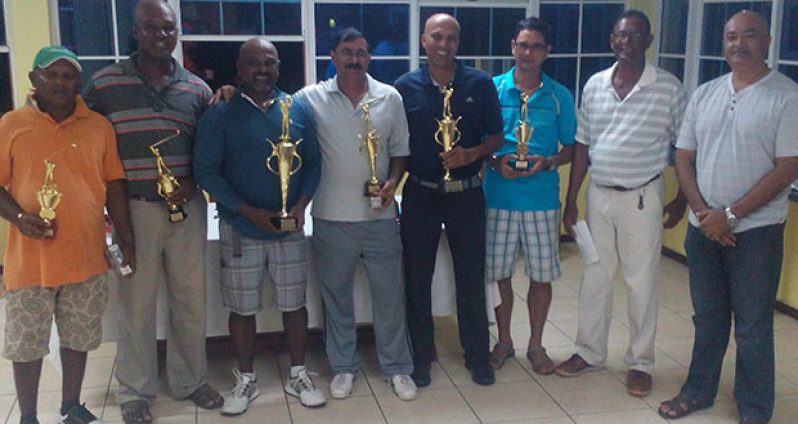 All smiles.In photo from left: I. Khan, B. Hackett, B. Ragnauth, R. Persaud, P. Persaud, I. Gouveia, Vice President P. Prashad, and President O. Ramroop.