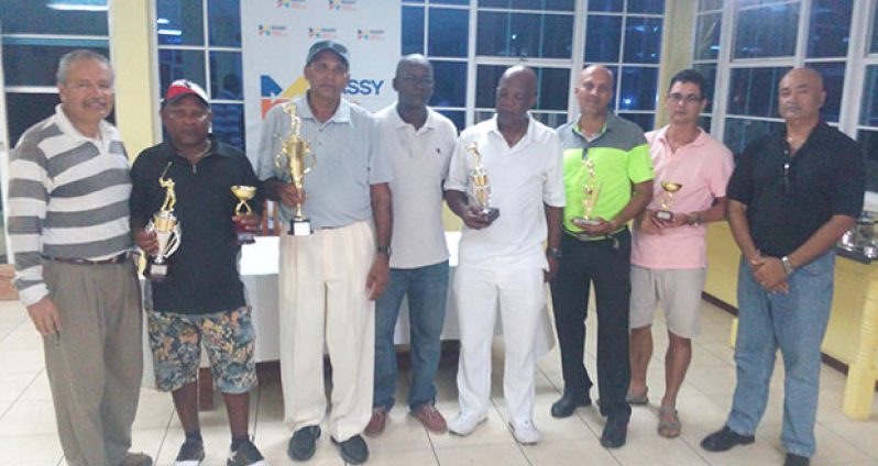 In photo:, Mr Austin and Mr Ramroop pose with the day’s winners. Left to right, J. Medina, I. Khan, F. Haniff, V. Austin, C. Adams, P. Persaud, I Gouveia, and club president O. Ramroop.