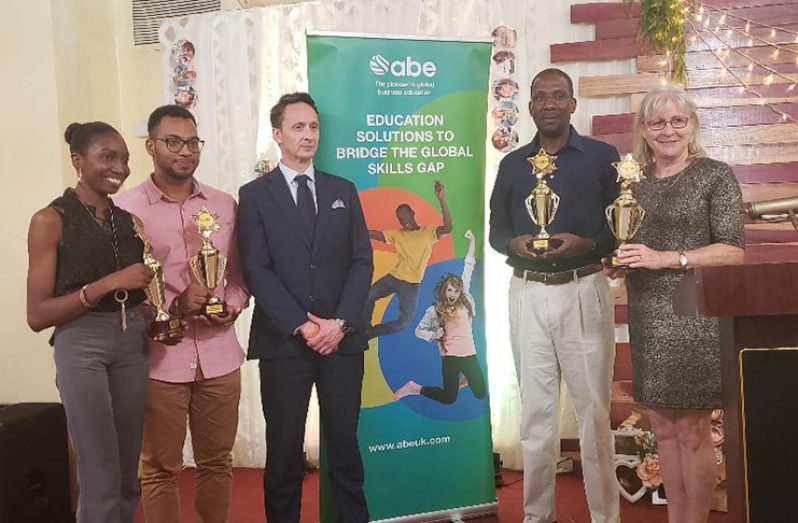 From left to right: ABE top students with ABE Chief Executive Officer, Rob May and Nations Chief Executive Officer, Dr Dexter Phillips and Director, Pamela O’Toole