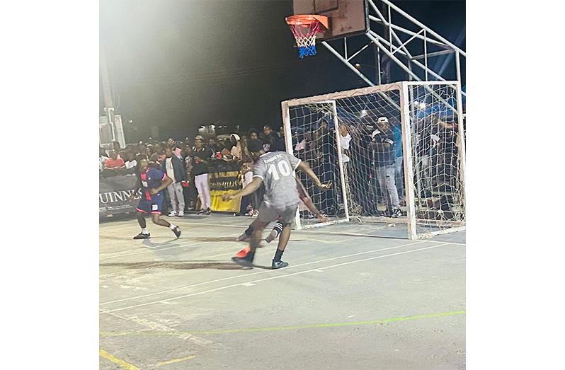 Capital FC’s Emmanuel Atkins about to slot home the winning goal with the goalkeeper beaten