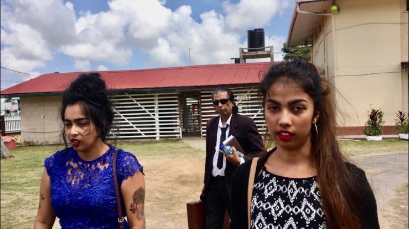 Hemwattie “Mona” Singh and Yashmanie “Tina” Ramsew make their way out of the New Amsterdam Magistrate’s Court on Wednesday
