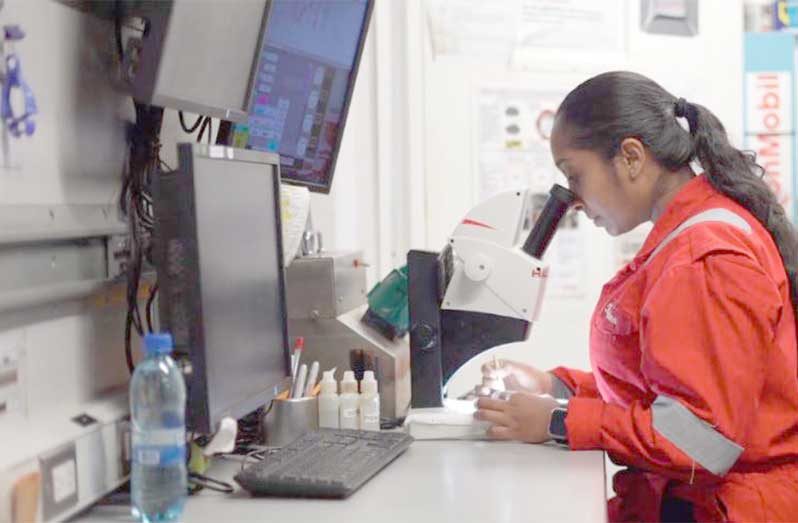 A Guyanese oil -and-gas worker is seen in action, representing one of the more than 6,100 locals employed in the sector