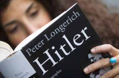 A woman reads Peter Longerich's new book 'Hitler' in Berlin, Germany, November 5, 2015.
Reuters/Hannibal Hanschke