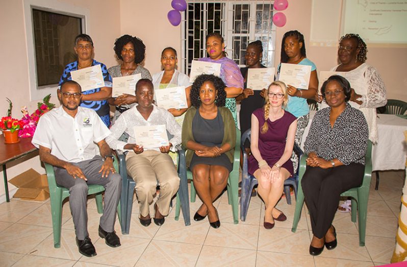 Women on the Move! Some of the members of ‘Women on the Move’ receive Women’s Empowerment certificates in Business Planning and Saving from VYC. In this Delano Williams photograph the Albouystown graduates pose with members of the VYC and Cuso International.