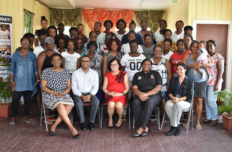 First Lady Mrs. Sandra Granger (centre), flanked by (from right), Lieutenant Colonel (ret'd) Yvonne Smith, Facilitator from the First Lady's Office, Mr. Yohan Pooran, Councillor, Ms. Andrea Marks and Facilitator, Ms.Crystal Baptise with participants of the workshop at Sophia.