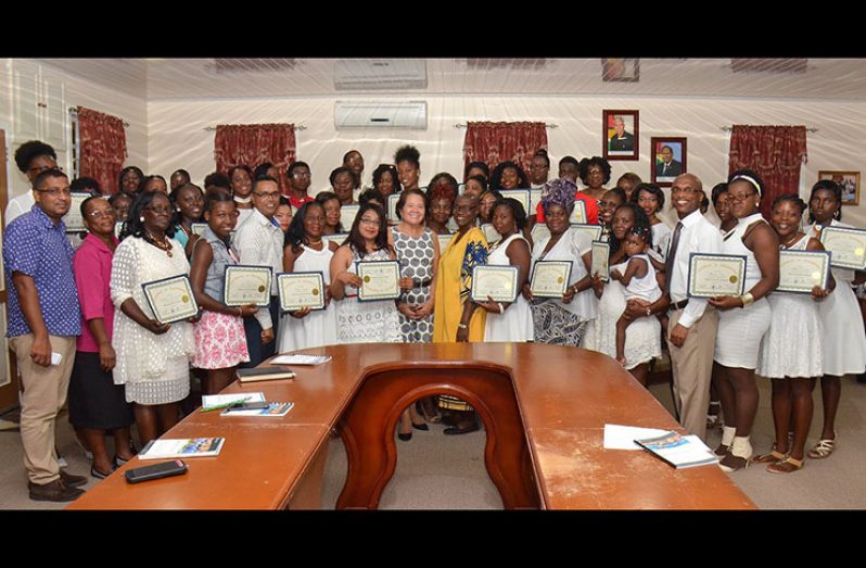 First Lady Sandra Granger is flanked by successful participants of the Self-Reliance and Success in Business workshop, deputy regional executive officer of Region Five, regional officials and facilitators of Interweave Solutions Incorporated.