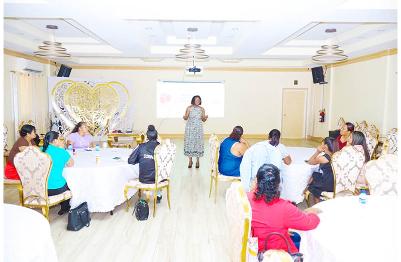 Participants of the Women’s Business Simulation Boot Camp listen attentively to one of the presenters