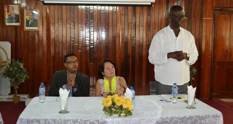 Regional Executive Officer, Mr. Rupert Hopkinson delivering his remarks at the opening of the Self-Reliance and Success in Business Workshop. Also in photo is First Lady, Mrs Sandra Granger and another official of the region