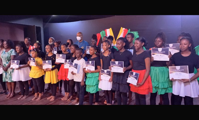 Minister Juan Edghill and youths at the camp’s closing ceremony