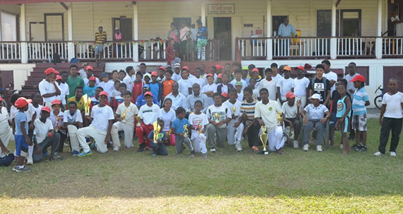 All Smiles! The cheerful camp attendees along with Club President Alfred Mentore, Alfred King and Coach Garvin Nedd (second row seated)