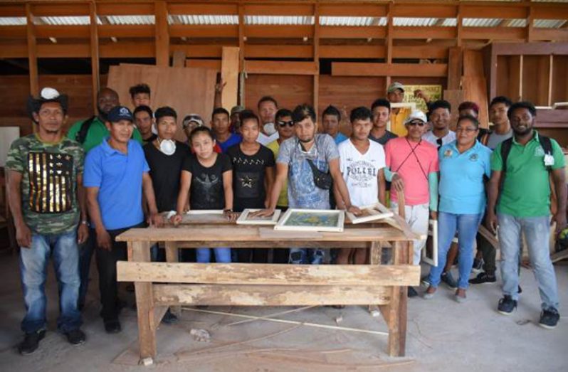 Participants with the trainers, Mark Thomas (second row, extreme left - green shirt), Rohan Mangal (front row, extreme right - green shirt) and Community Development Officer, Moruca Sub-Region, Mary Zola Da Silva (front row, second from right - blue jersey)