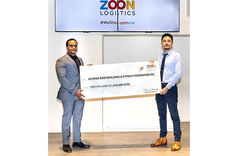 GBBFF Roger Callender collecting Cheque from Zoon CEO Dave Savoury